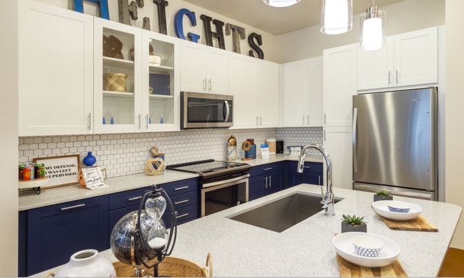 Frameless Sorano cabinetry in Navy Lux and White Satin